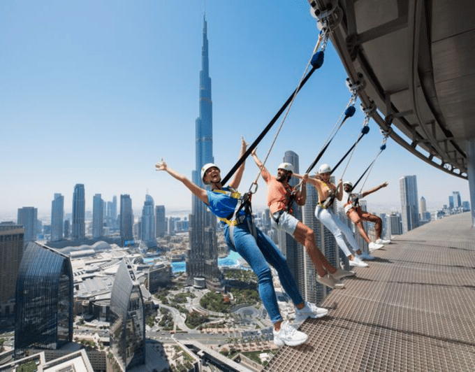 Participant secured in harness system for Sky Views Edge Walk