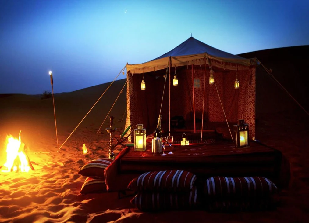 Panoramic view of Arihant Travel's overnight desert safari camp in Dubai at dusk