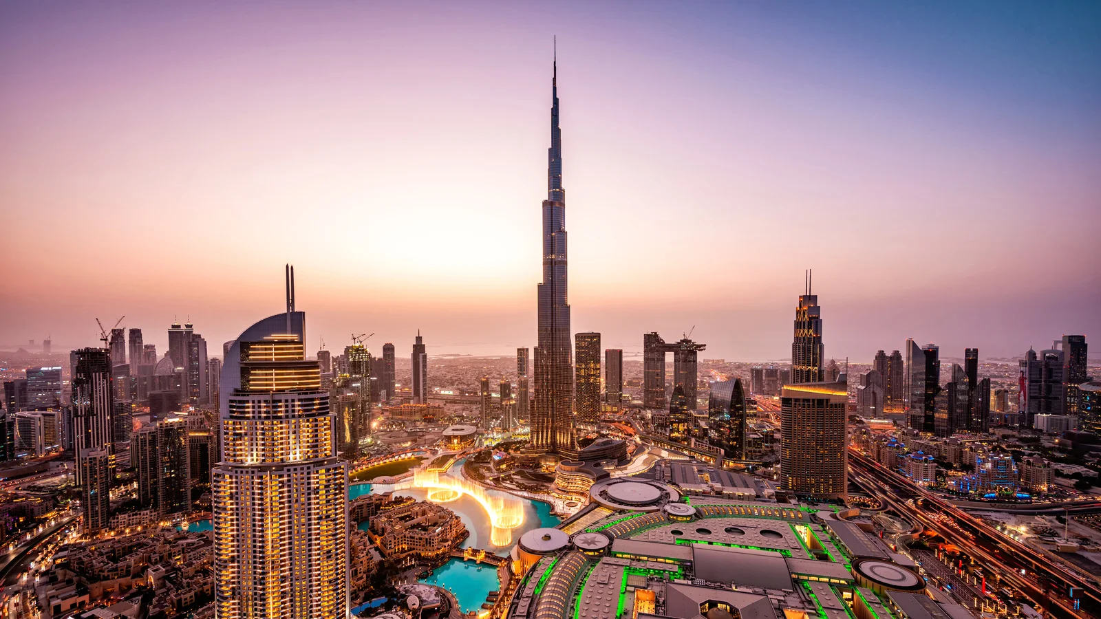 Burj Khalifa dominating the Dubai skyline at sunset