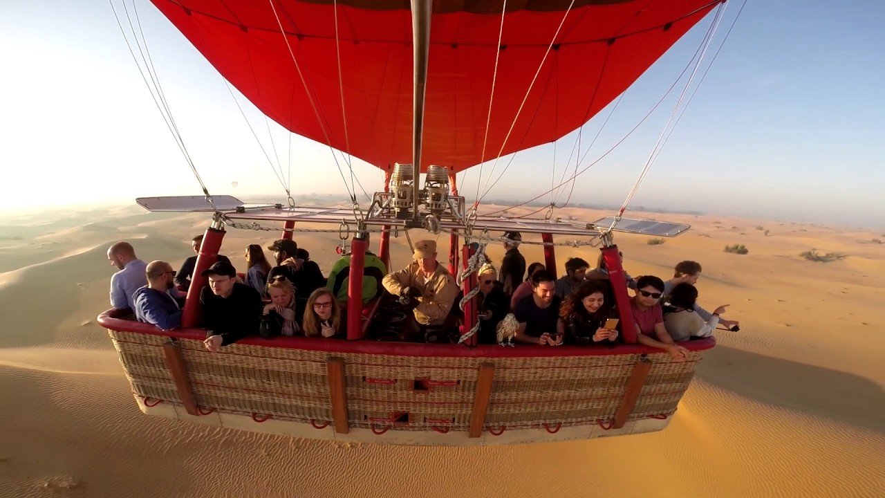 Passengers boarding hot air balloon basket